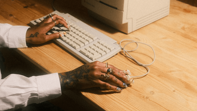 Getting ‘Well’ Killed My Ambition – Here’s How I Got It Back Picture of hands on a keyboard and desk