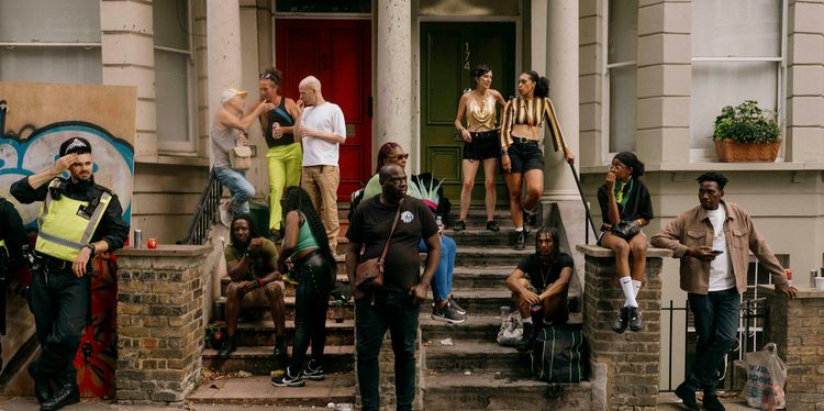 Bringing People Together: Notting Hill Carnival Through The Lens Of Ollie Tikare photograph showing people celebrating at notting hill carnival