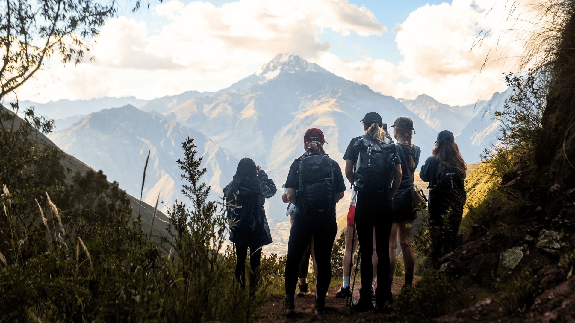 hikers look at mountain view