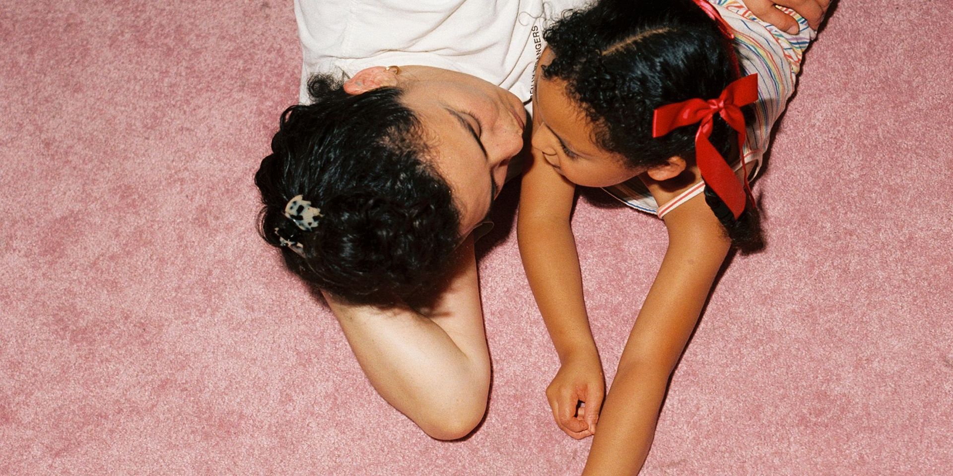 Picture of mother and daughter talking together on floor
